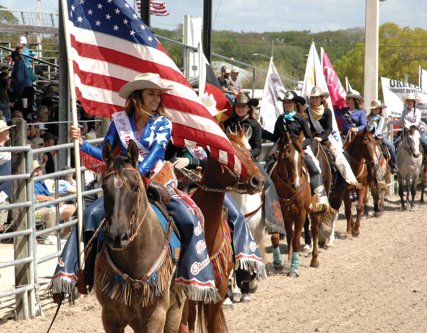 OKEECHOBEE -- The rodeo starts with the grand entry of the American flag, followed by sponsor flags.